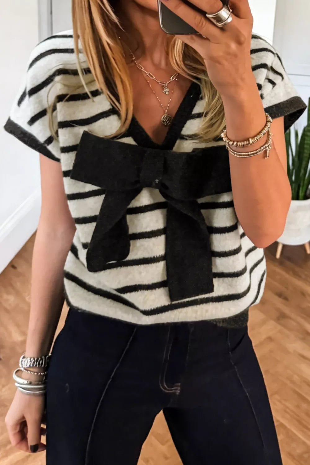 Striped short sleeve knit top with oversized bow