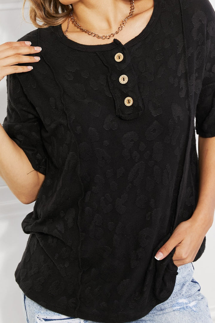Textured leopard short sleeve top with button placket