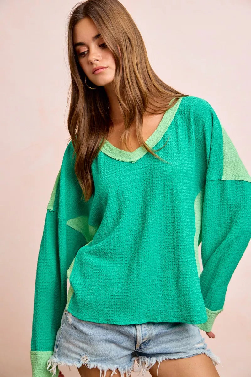 Color block long sleeve textured jersey top with raw-cut edges