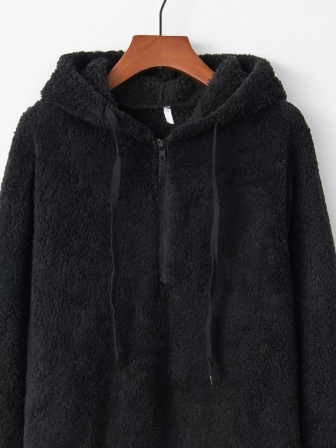 Plush half-zip fleece hoodie with drawstring hood and pockets