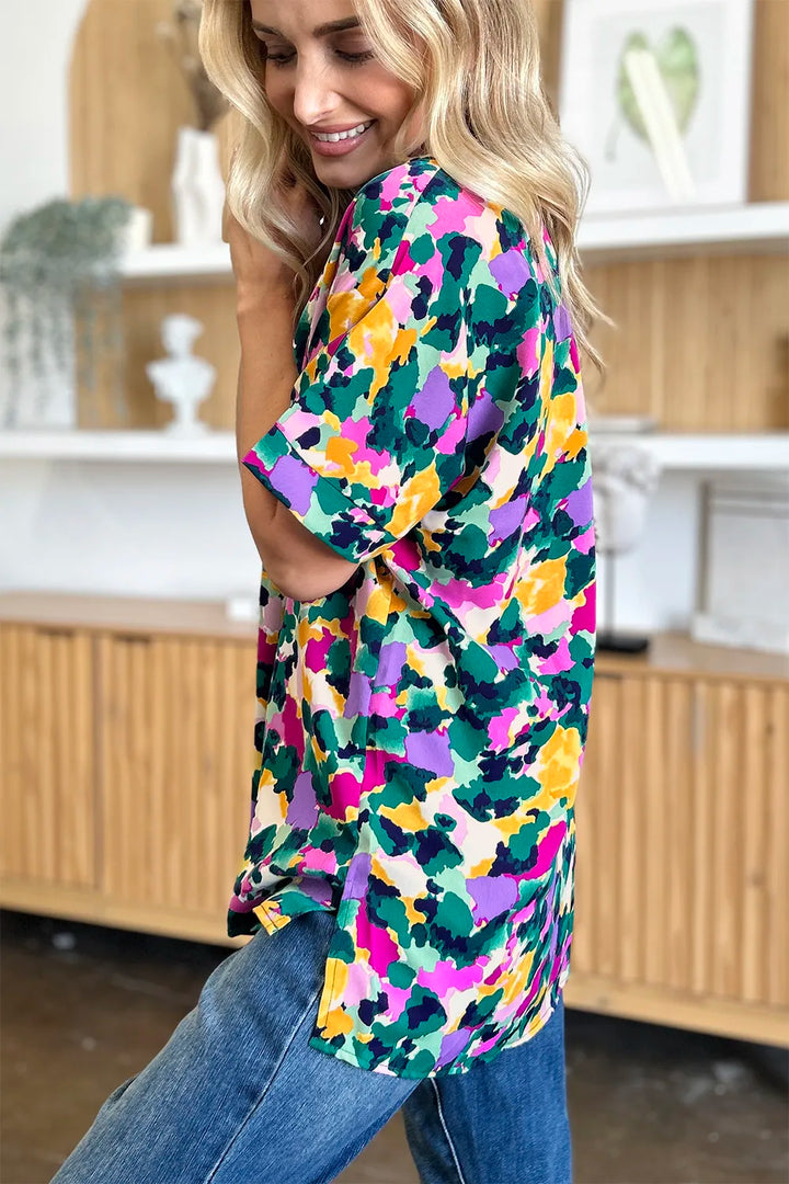 Abstract print v-neck tunic top with flutter sleeves and side slits