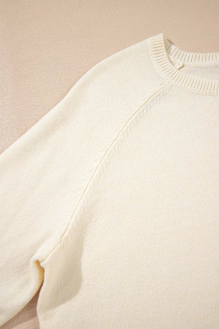 Button-cuff raglan sleeve crew neck sweater