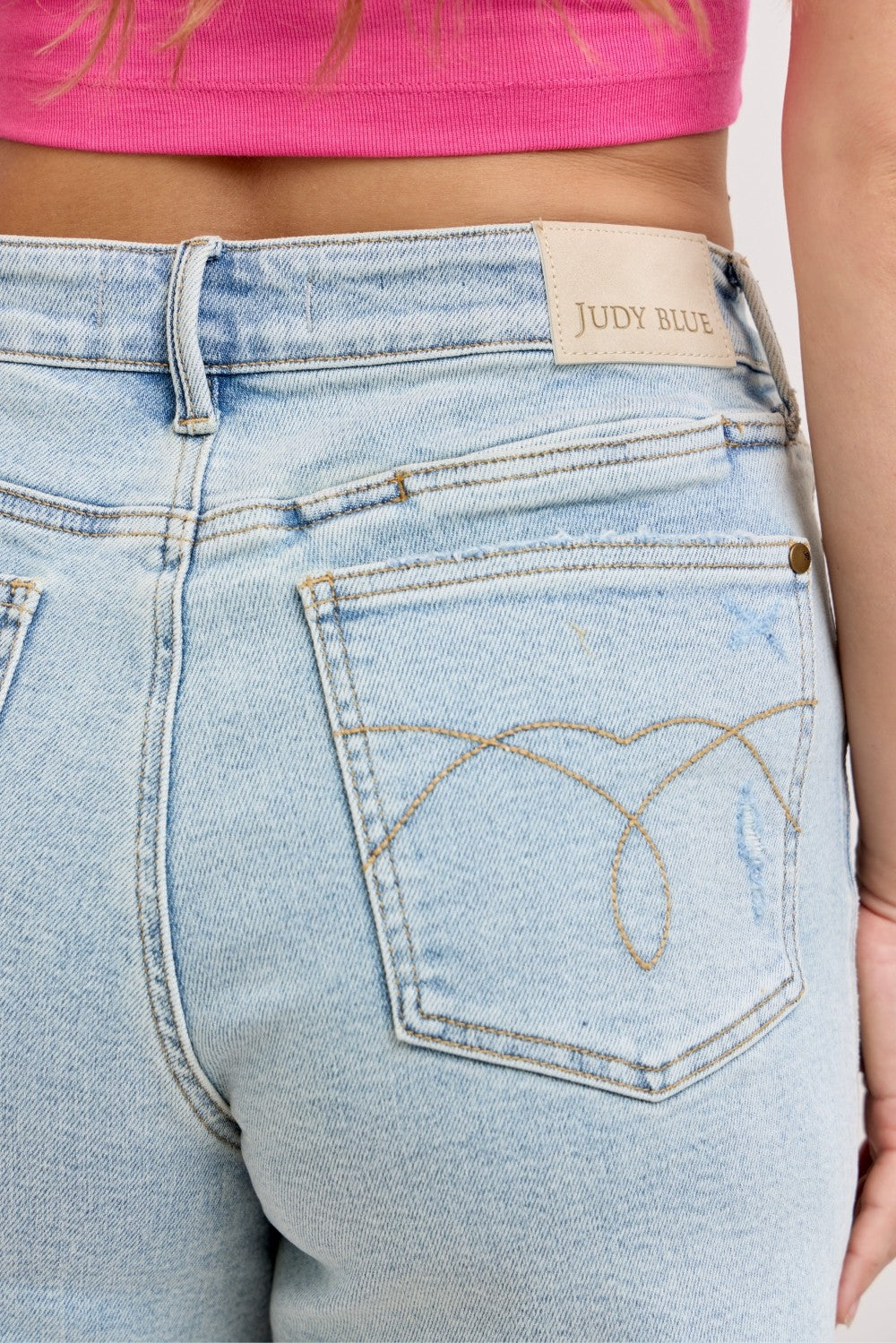Distressed high-rise denim shorts with raw frayed hem