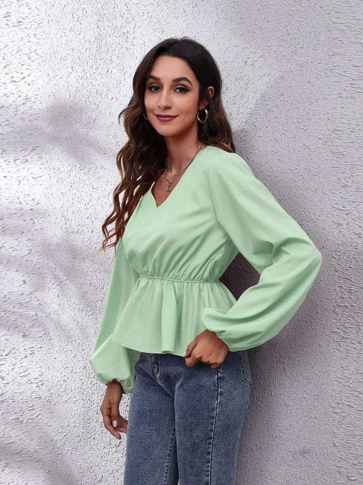Balloon sleeve peplum blouse with V-neck