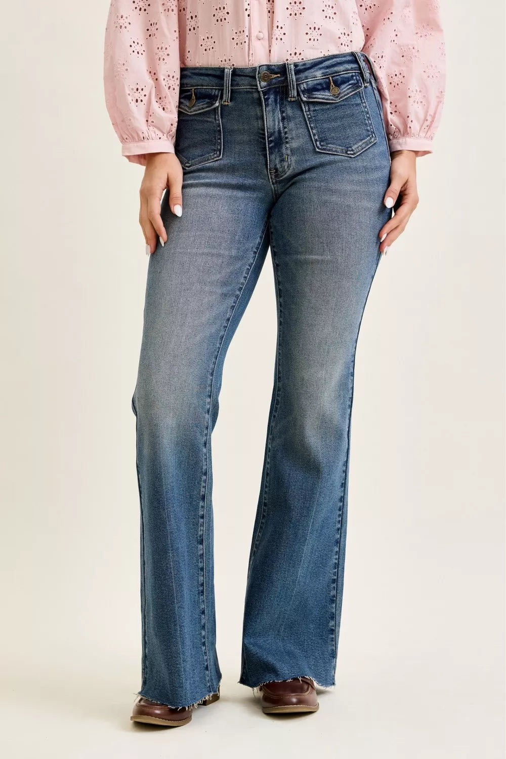 MD Judy Blue mid-rise flare jeans with front flap pockets and raw hem
