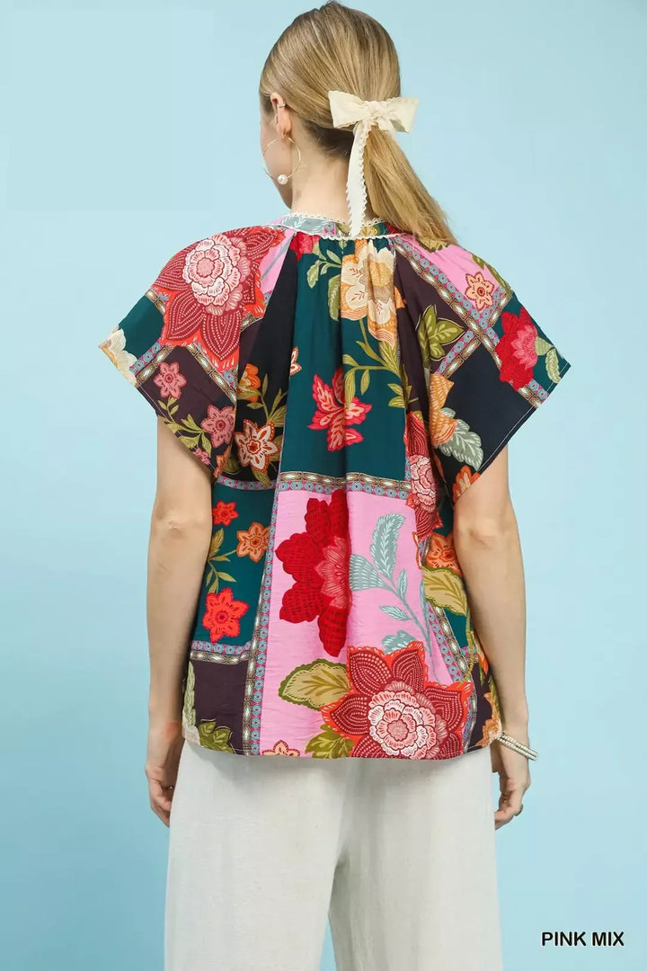 Mixed floral patchwork top with tassel tie neck