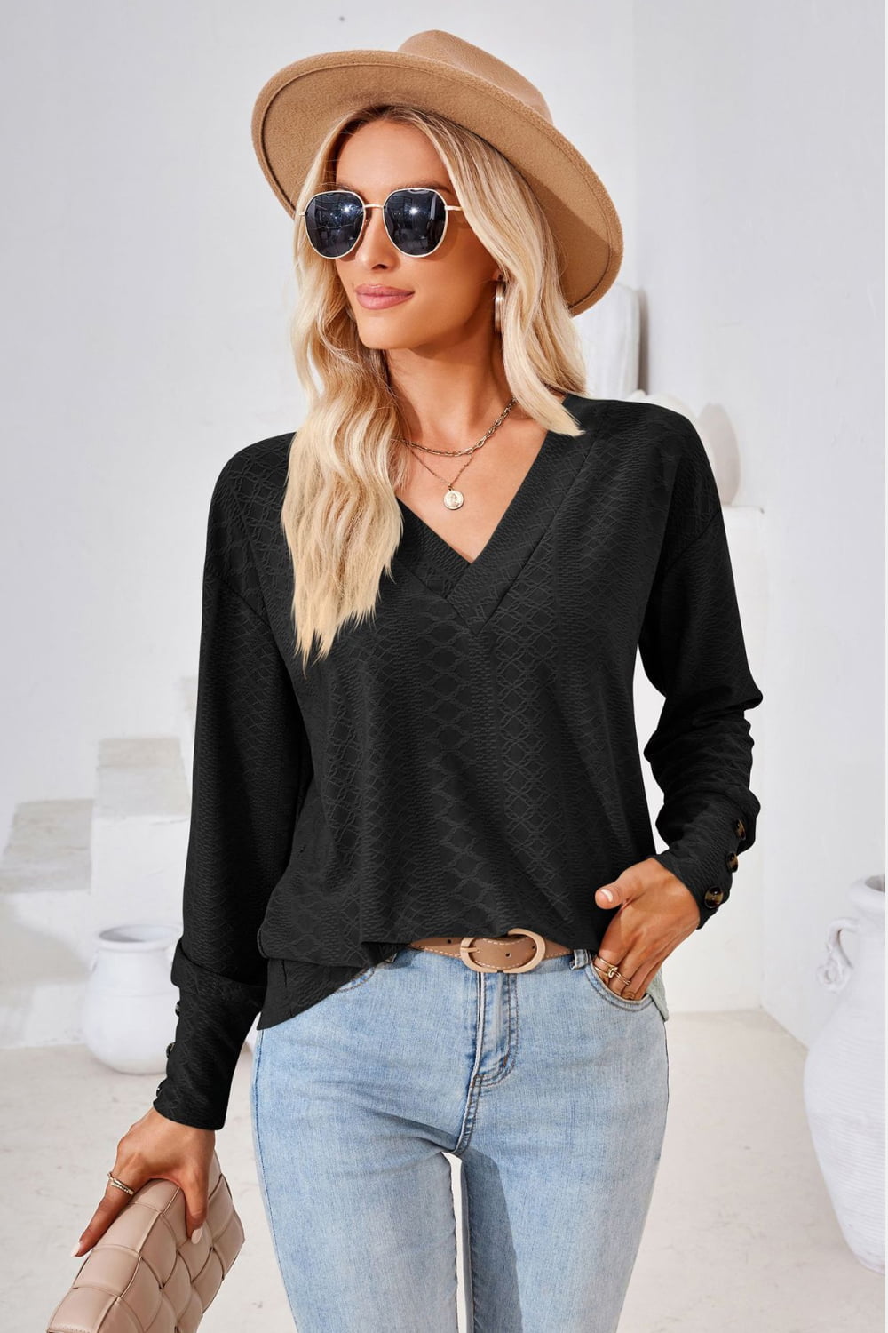 Black Textured knit V-neck long sleeve top with button cuffs