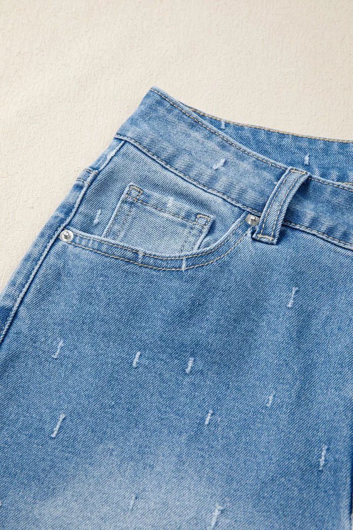 Distressed wide-leg jeans with tummy control and raw hem