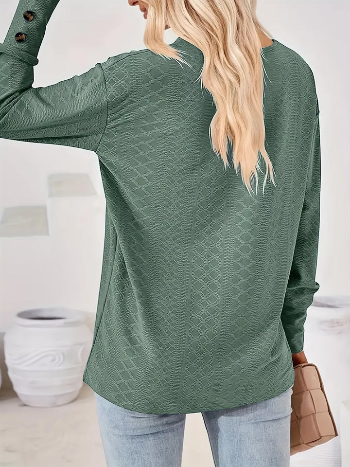 Plus size textured V-neck long sleeve top with button cuffs