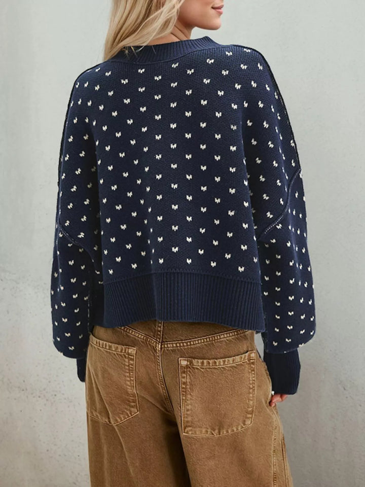 Dropped shoulder knit sweater with ribbed trim and side slits