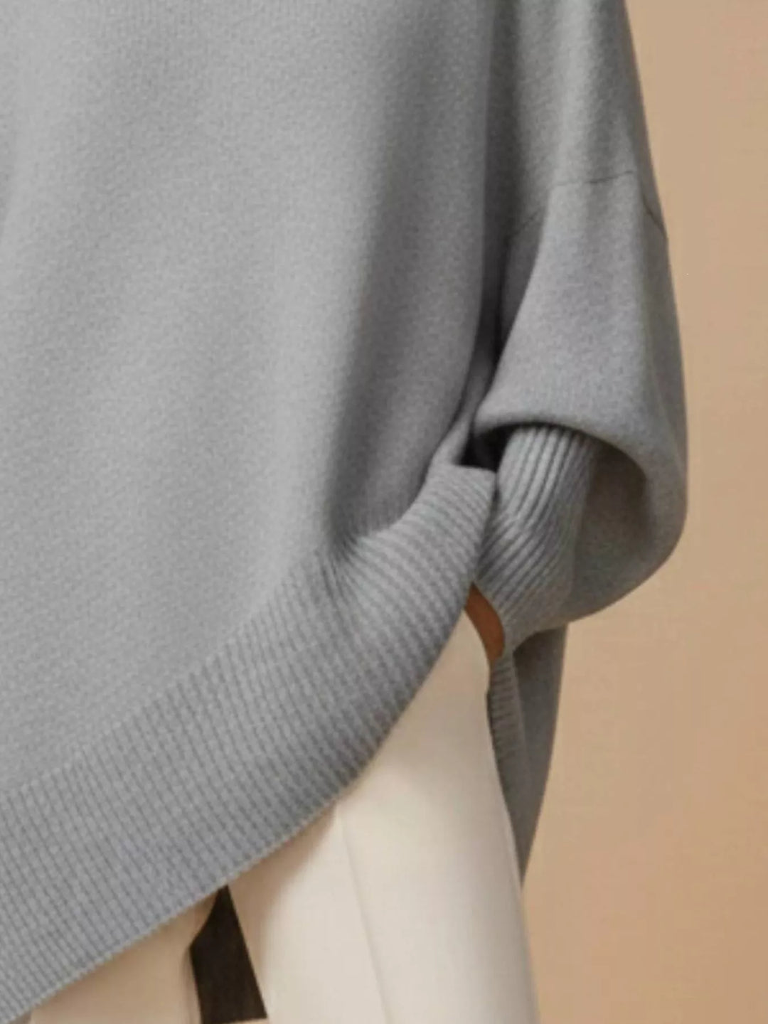 Batwing sleeve asymmetric hem oversized knit sweater