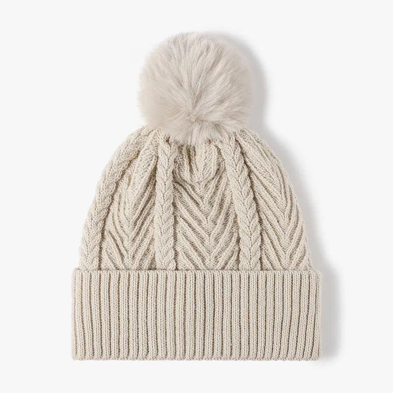 Beige Cable knit beanie with faux fur pompom and ribbed cuff