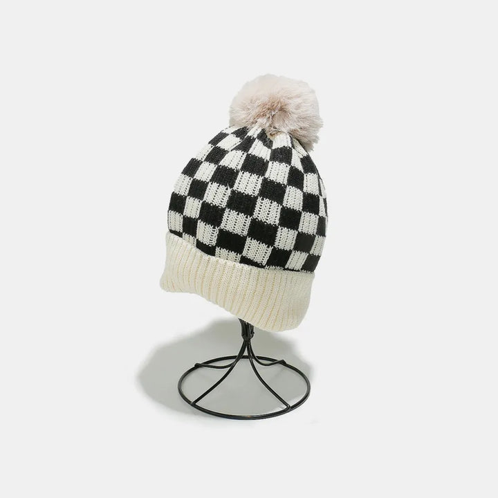 Ivory Checkerboard knit beanie with faux fur pompom