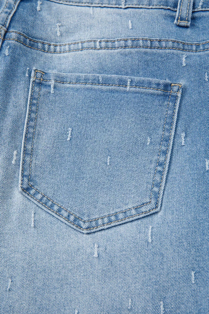 Distressed wide-leg jeans with tummy control and raw hem