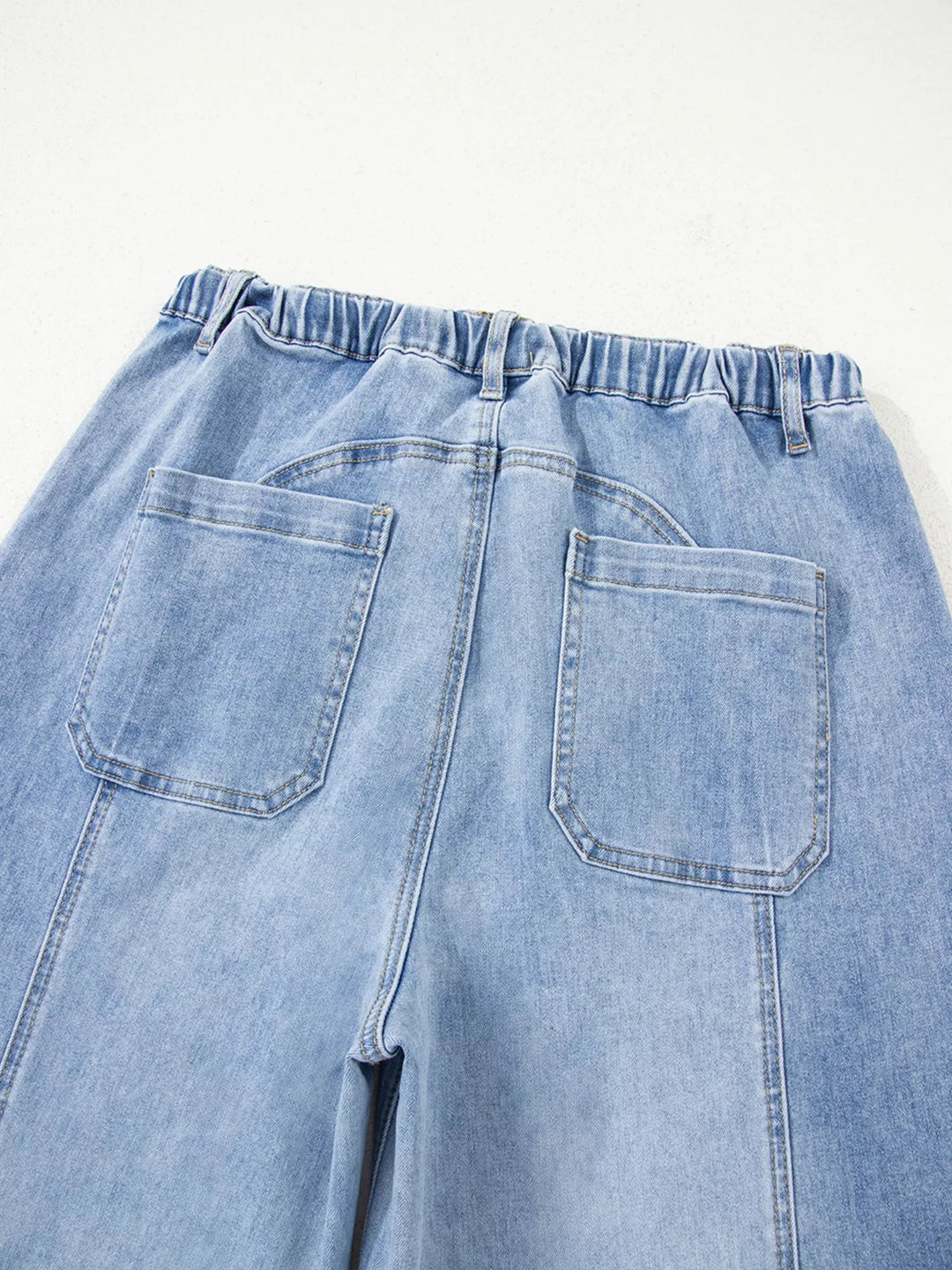 Wide-leg drawstring jeans with raw frayed hem