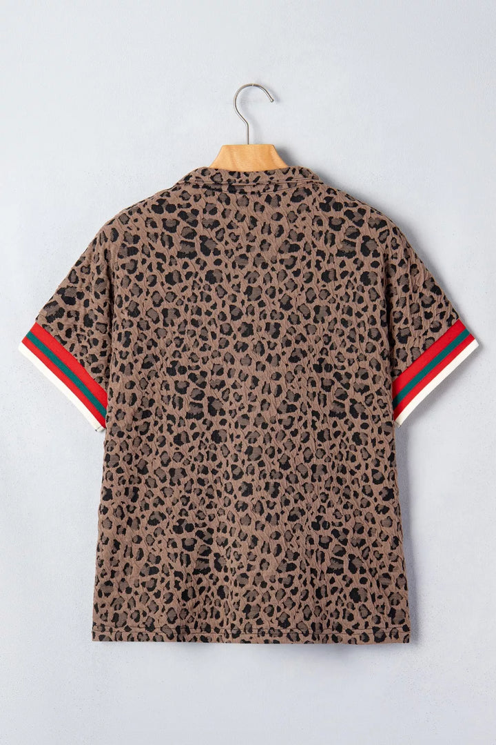 Leopard half-zip short sleeve top with striped collar and cuffs