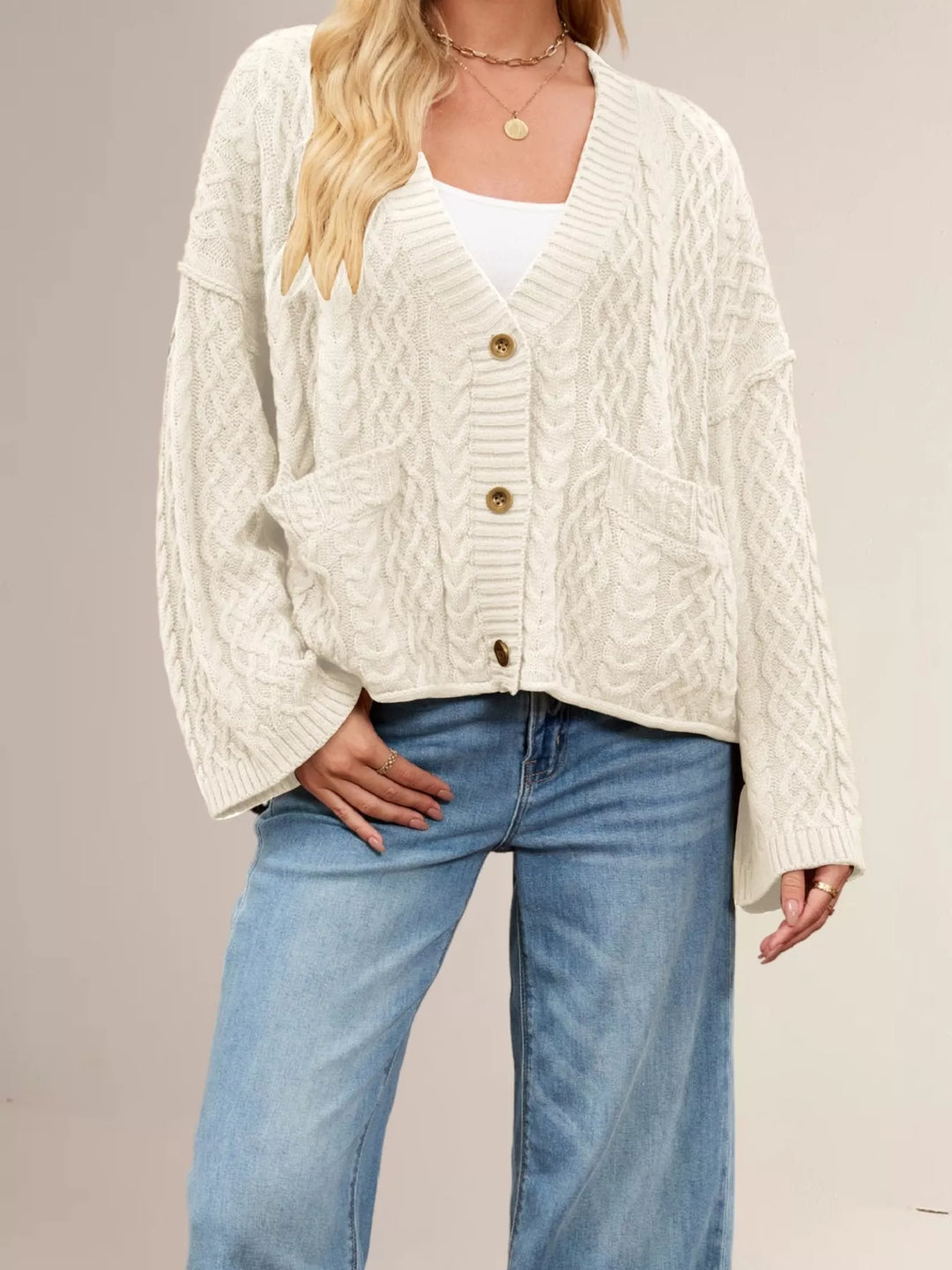Cable knit button-front cardigan with patch pockets