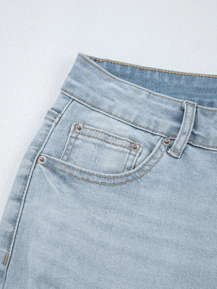 Distressed mid-rise ankle skinny jeans with raw hem