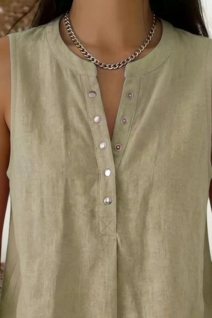Snap-front sleeveless blouse with V-neckline