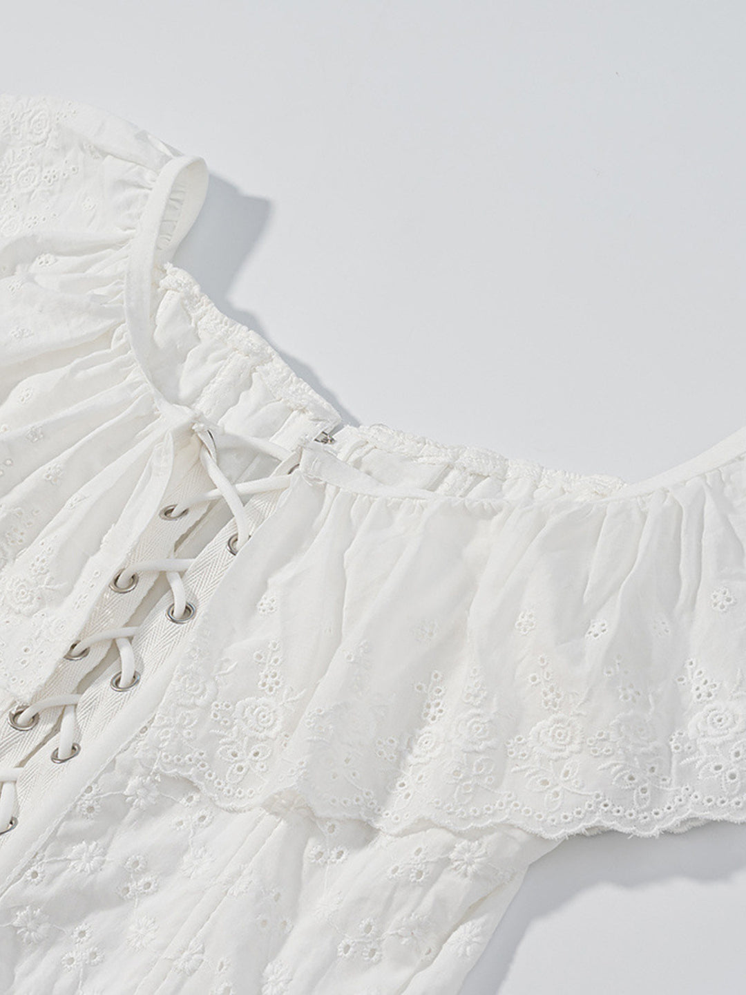 Eyelet ruffle-trim corset tank top with lace-up back