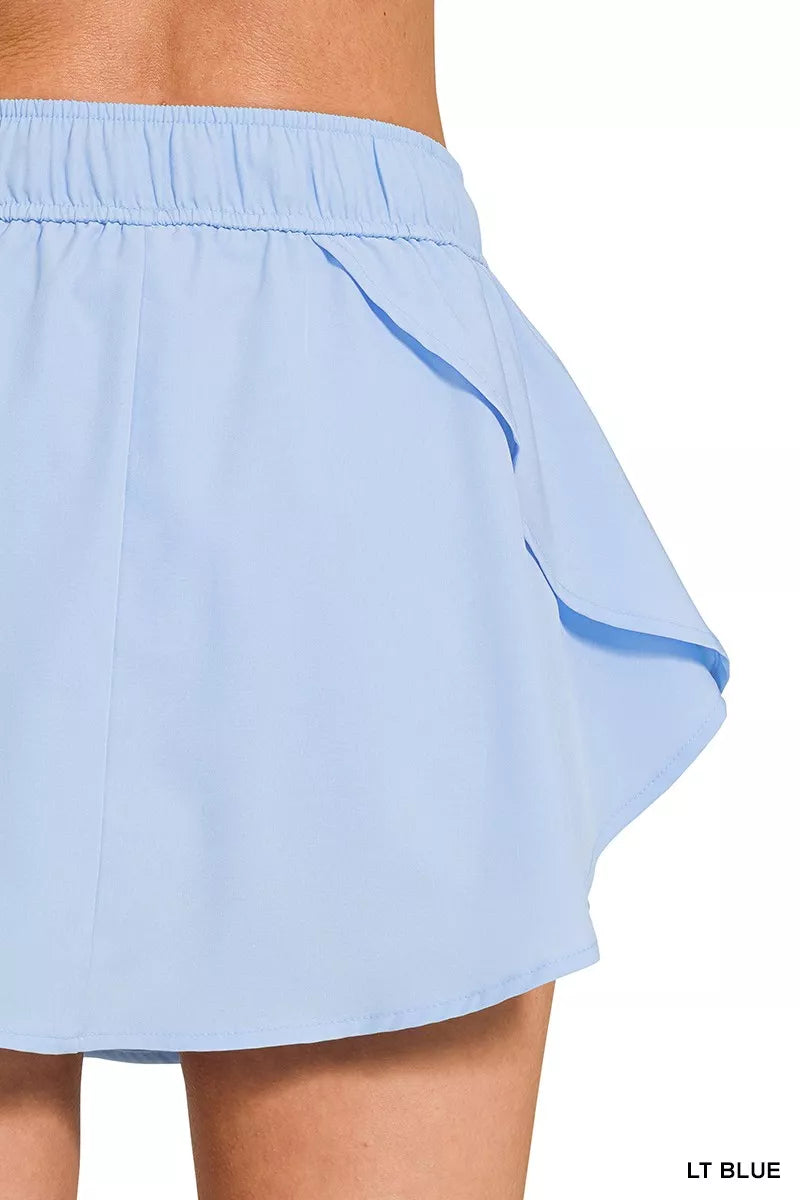 Active woven skort with drawstring waist and pockets