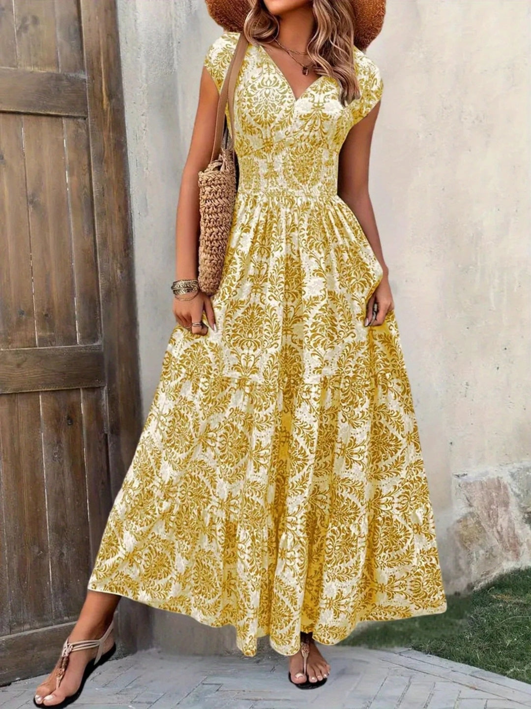 Smocked tiered maxi dress with cap sleeves and side slit