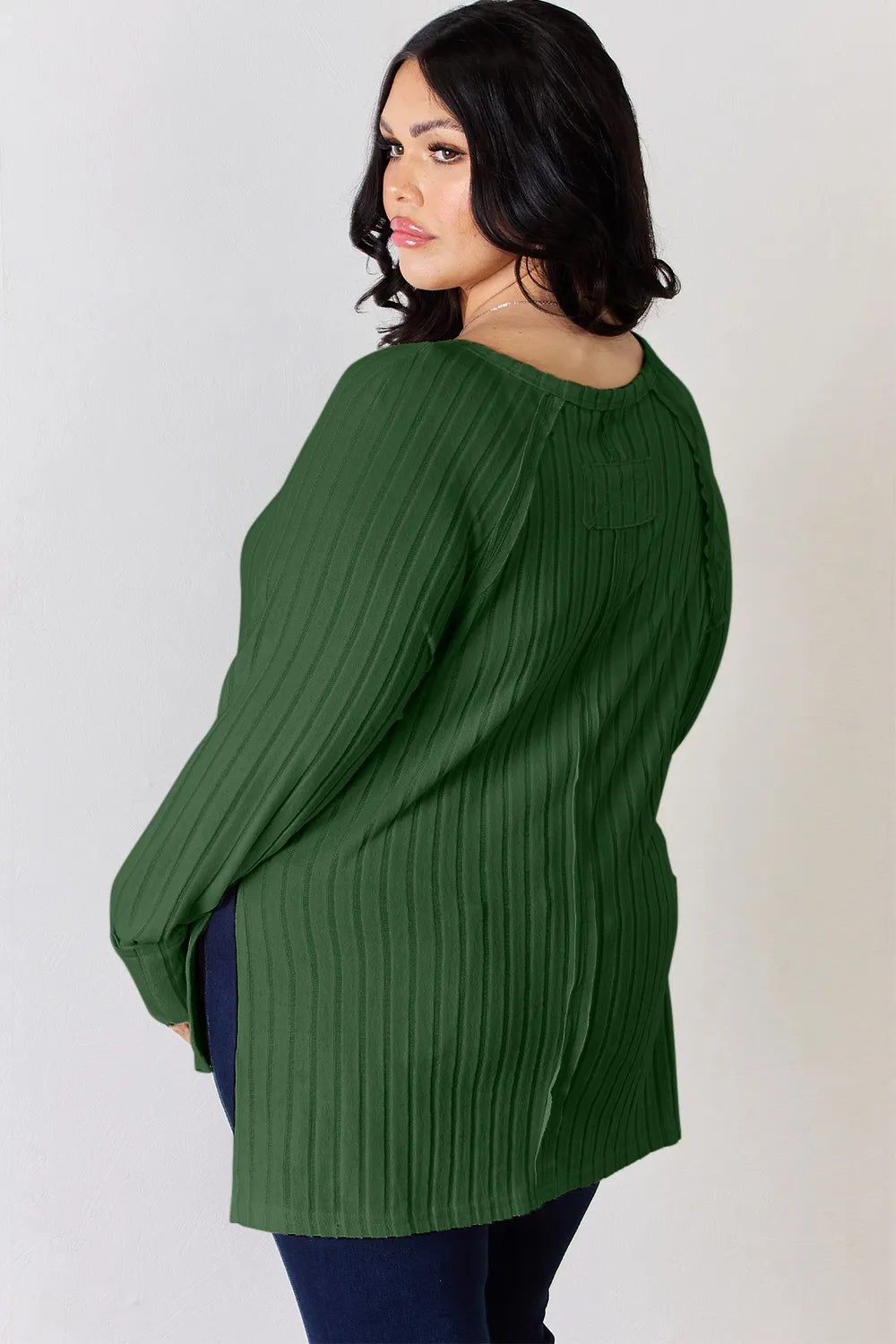 Ribbed knit round neck long sleeve top with side slits