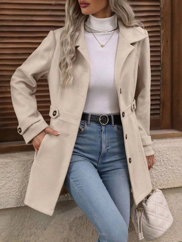 Single-breasted lapel coat with waist tabs and pockets