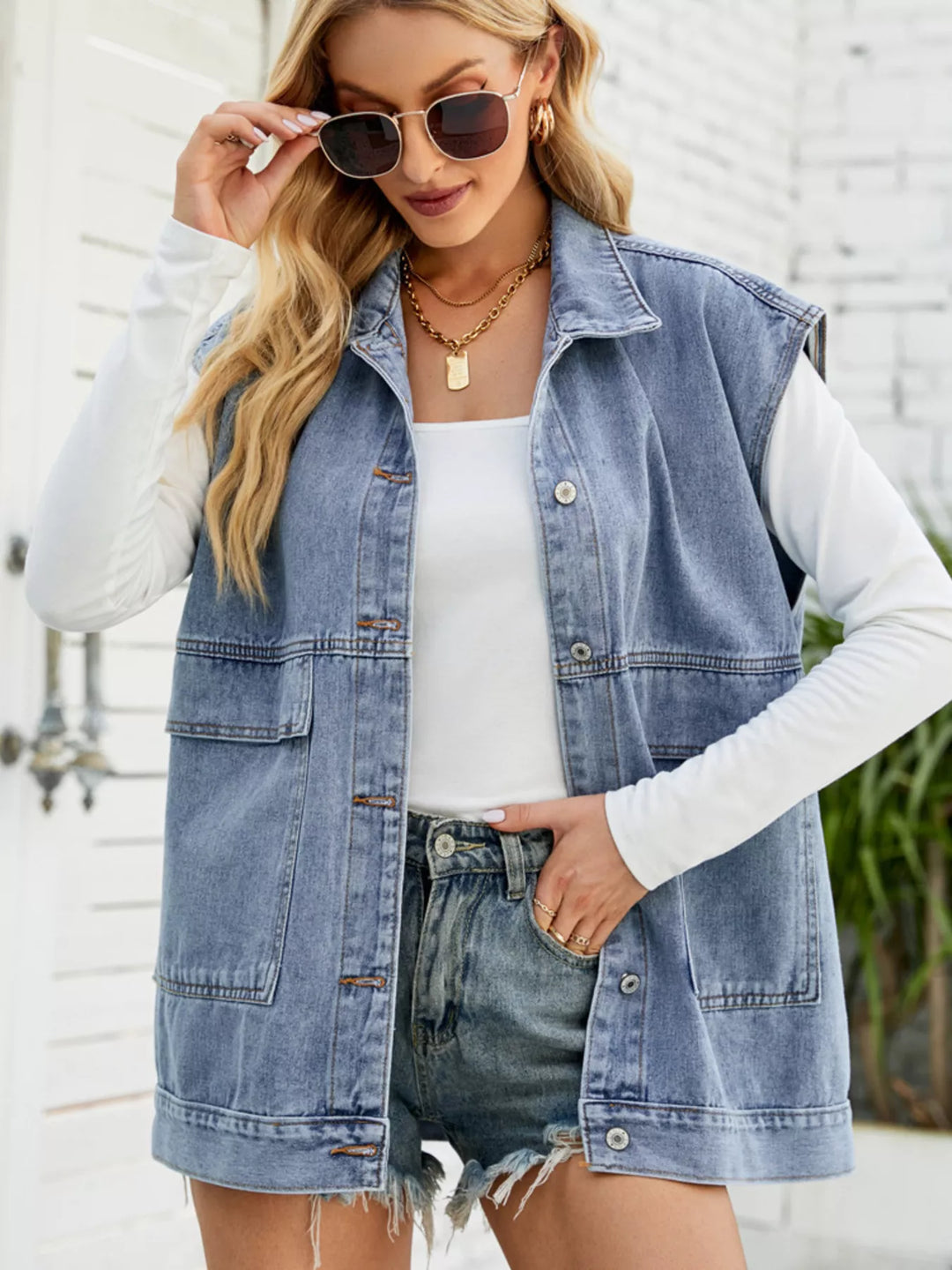 Sleeveless button-down denim vest jacket with patch pockets