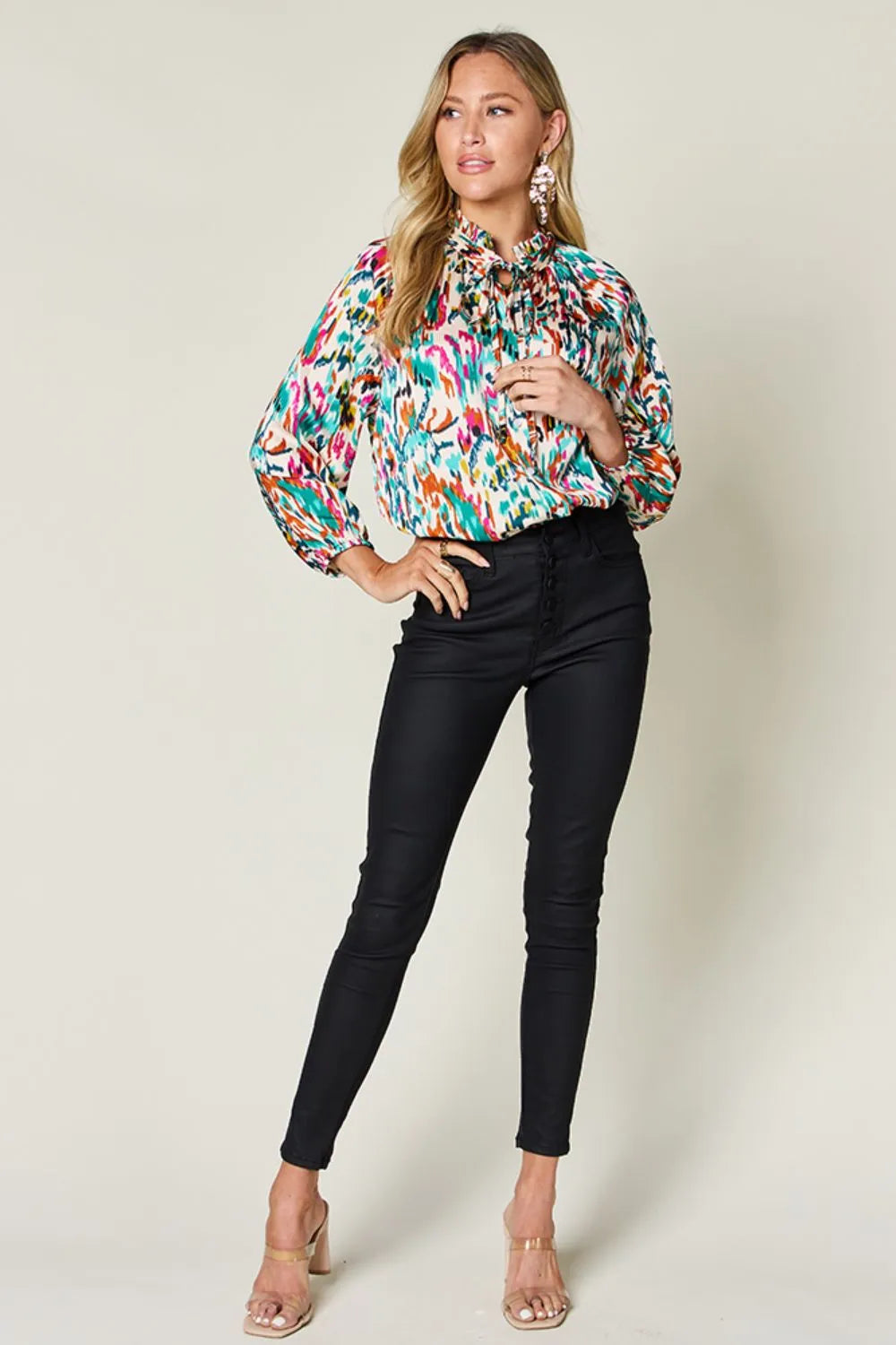 Abstract print button-up shirt with tie neck and long sleeves