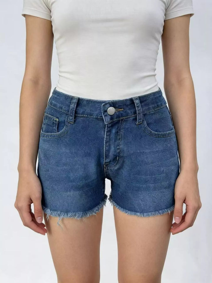 Raw hem denim shorts with frayed edges and five-pocket styling