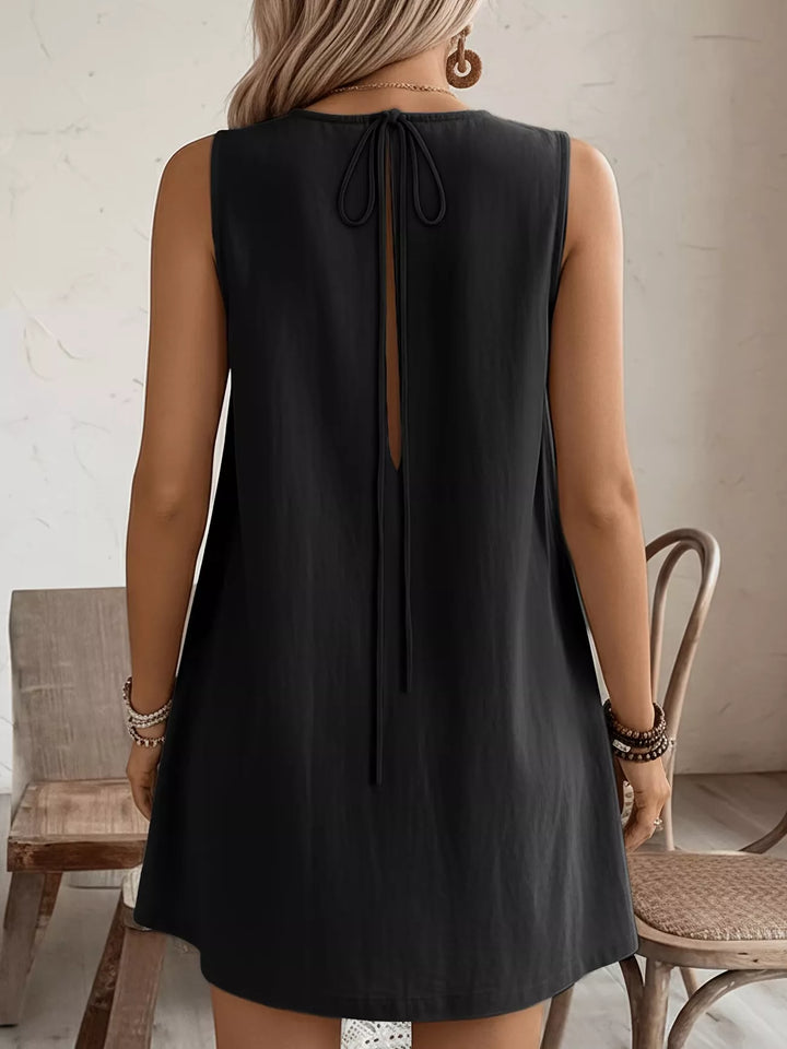 Ruffle-trim sleeveless mini dress with side pockets