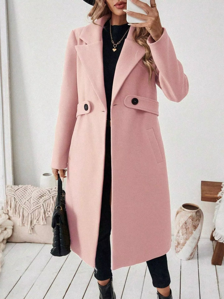 Longline notch lapel coat with single-button waist tab