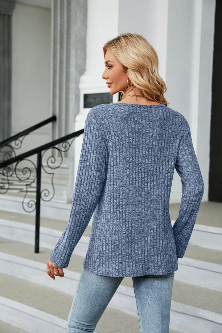 Ribbed knit long sleeve top with side buttons and slit hem