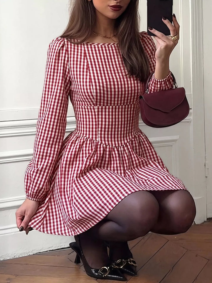 Backless gingham mini dress with bow tie and puff sleeves