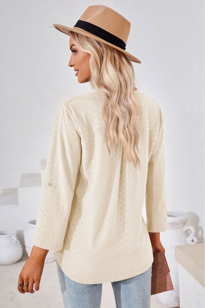 Textured split v-neck blouse with roll-tab sleeves