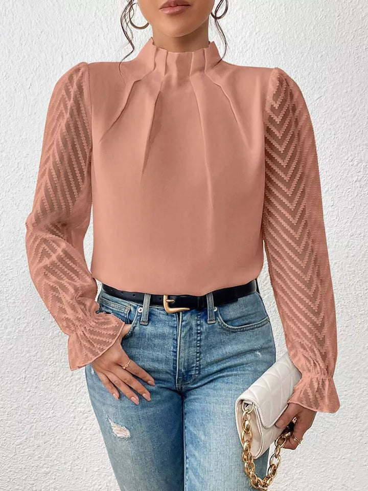 Burnt Coral Mock neck blouse with sheer textured flounce sleeves