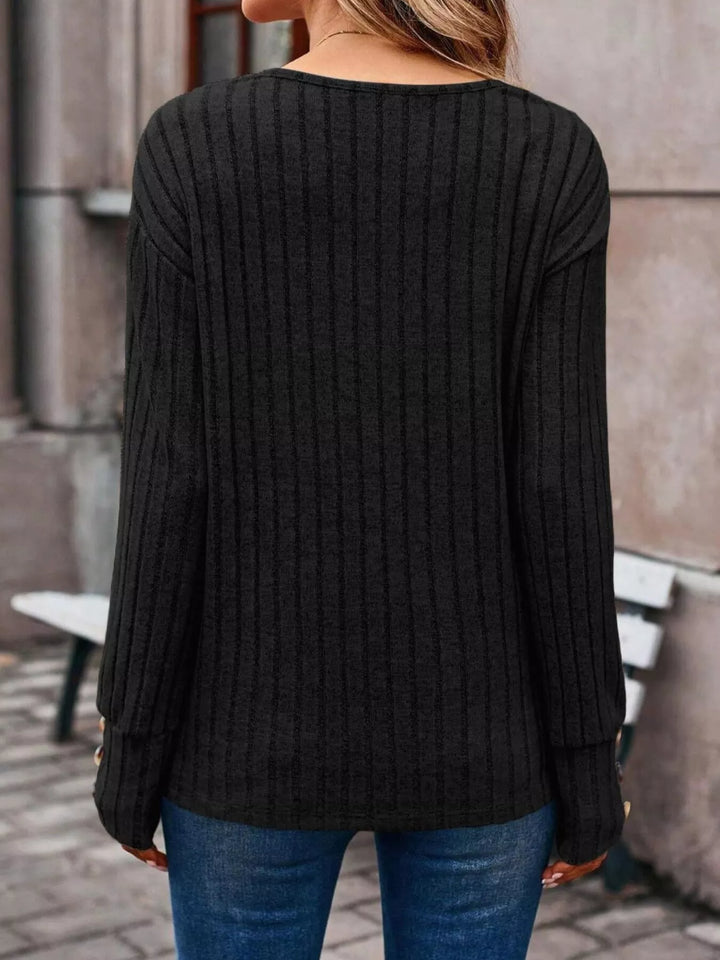 Ribbed knit V-neck top with buttoned cuffs