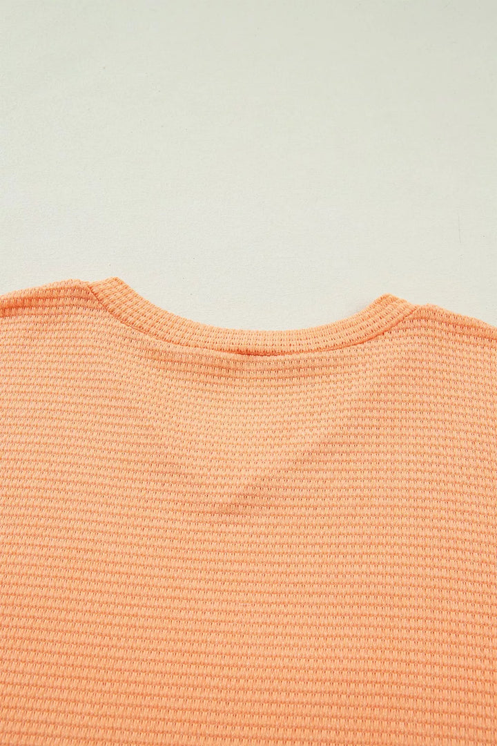 Waffle knit V-neck tee with cuffed short sleeves