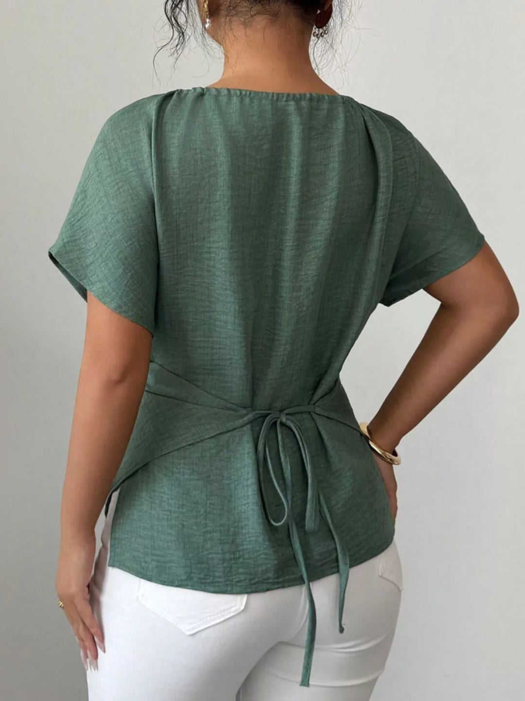 Wrap-front short sleeve blouse with beaded keyhole neckline
