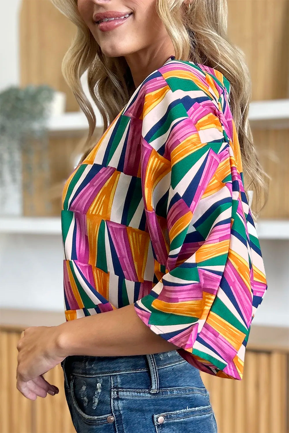 Geometric print notched neck dolman sleeve top