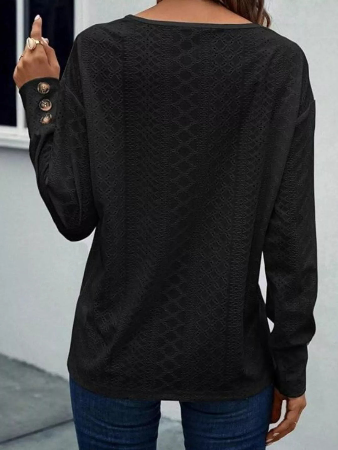 Eyelet V-neck long sleeve top with button cuffs