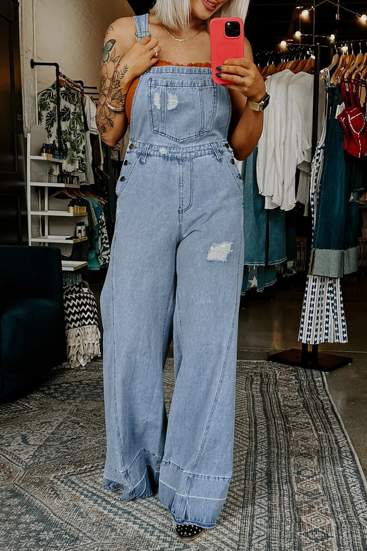 Distressed wide-leg denim overalls with adjustable straps