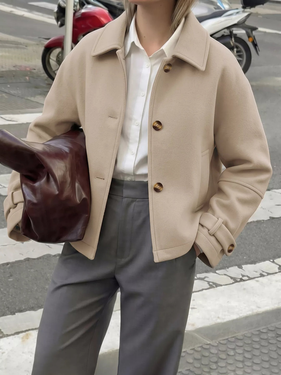 Cropped collared button-up jacket with cuff tabs