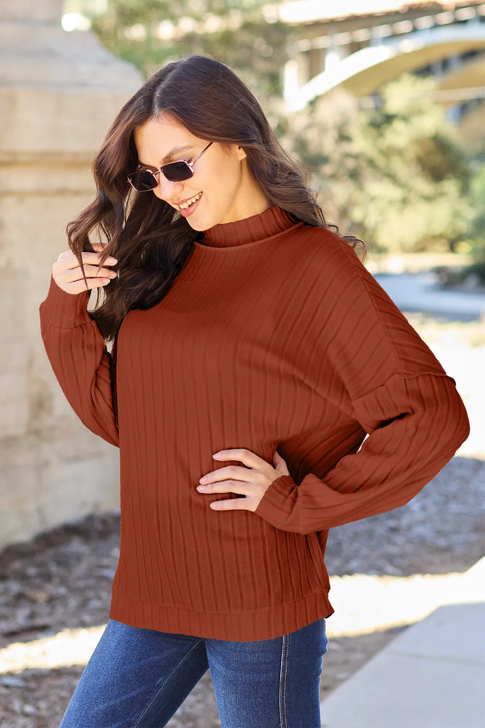 Rust Ribbed exposed-seam mock neck knit top with drop shoulders