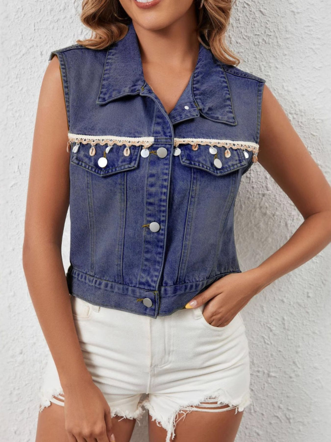 Sleeveless denim vest with shell and coin trim