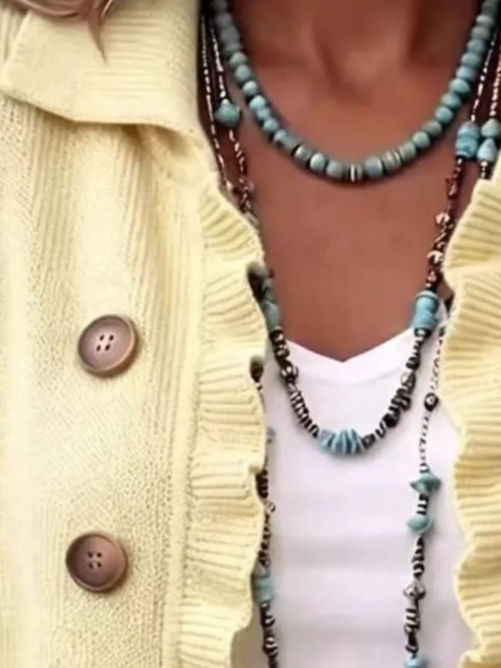 Ruffle trim knit cardigan with collar and decorative buttons