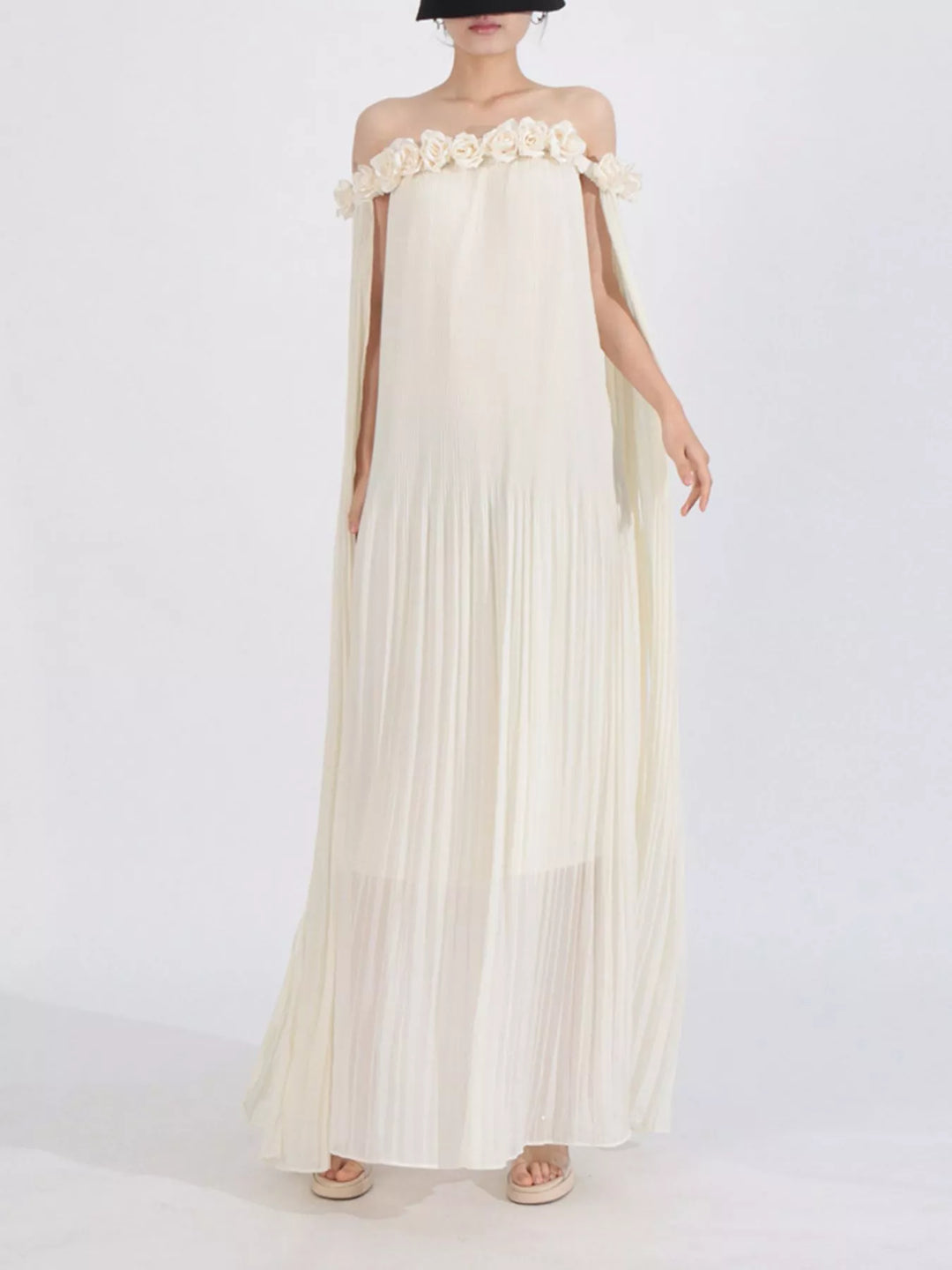 Off-shoulder pleated maxi dress with rosette neckline
