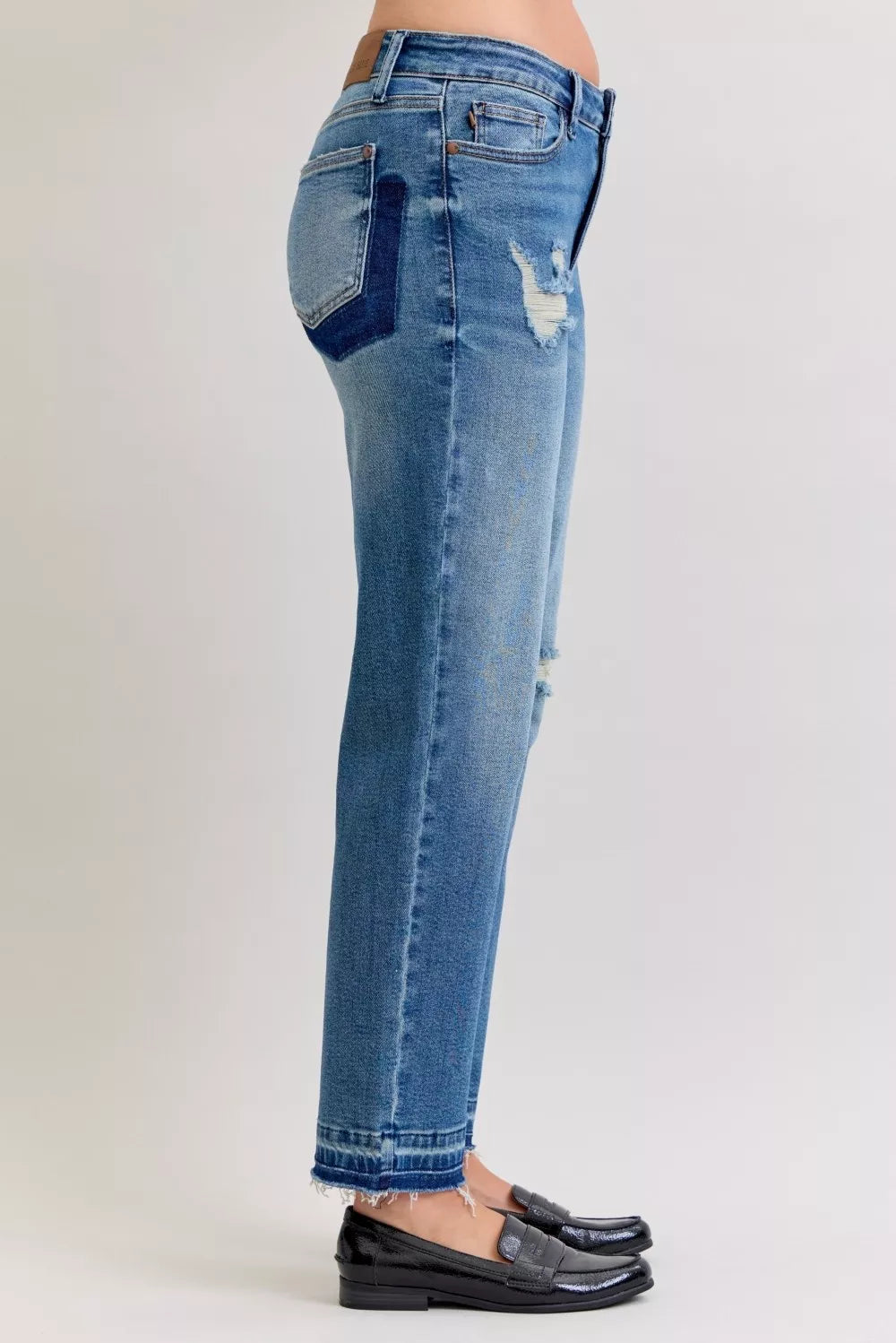 Distressed mid-rise boyfriend jeans with released raw hem