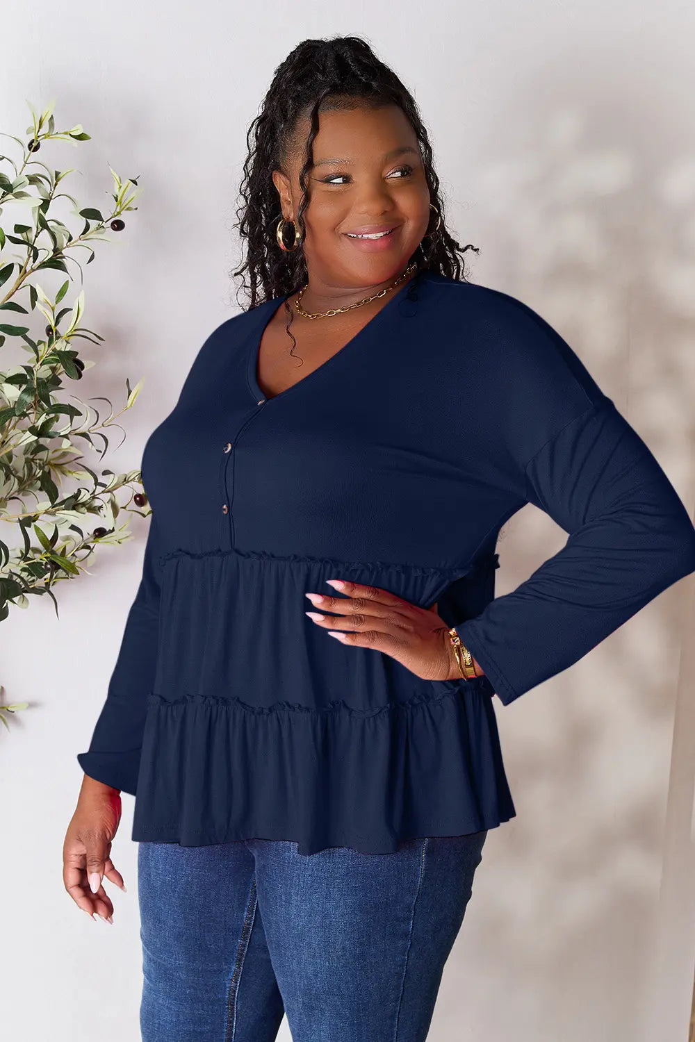 Half-button long sleeve blouse with tiered ruffle hem